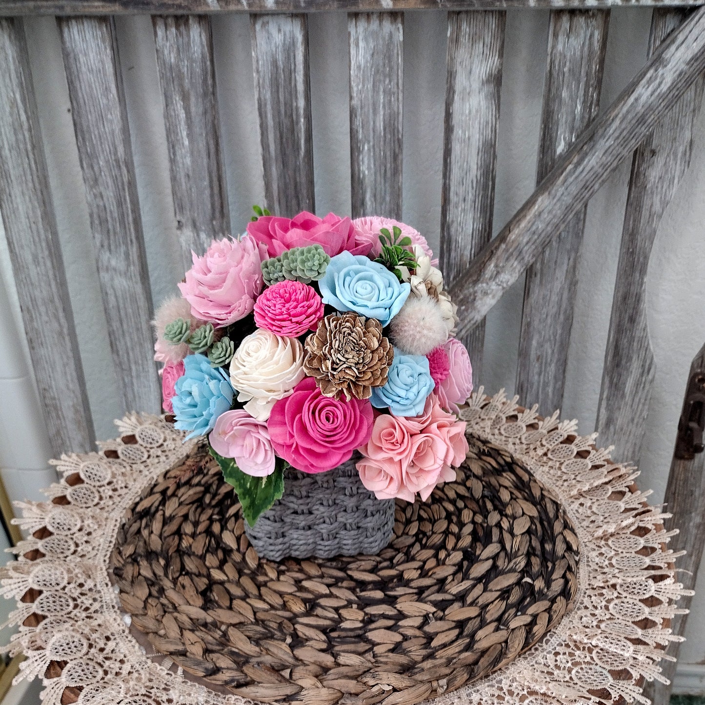 Pink, Blue & Natural Sola Wood Flower Centerpiece in Woven Gray Basket