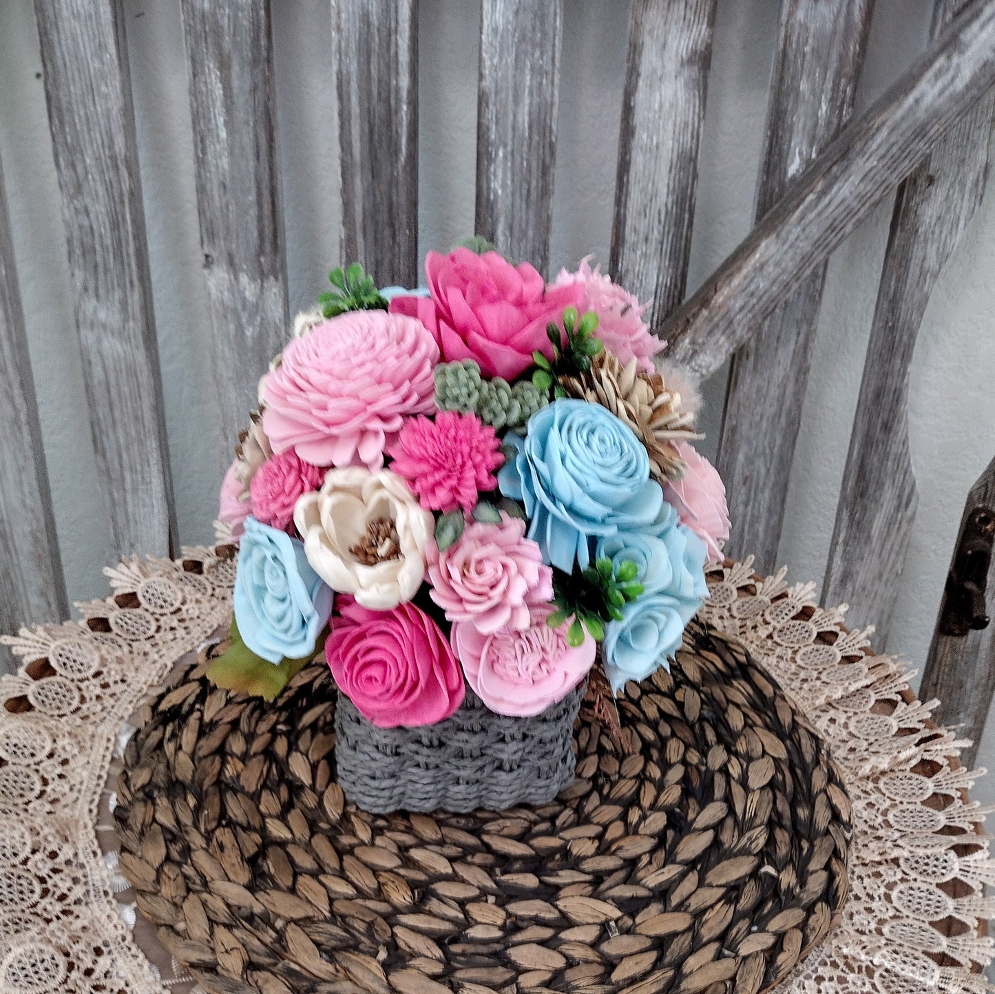 Pink, Blue & Natural Sola Wood Flower Centerpiece in Woven Gray Basket