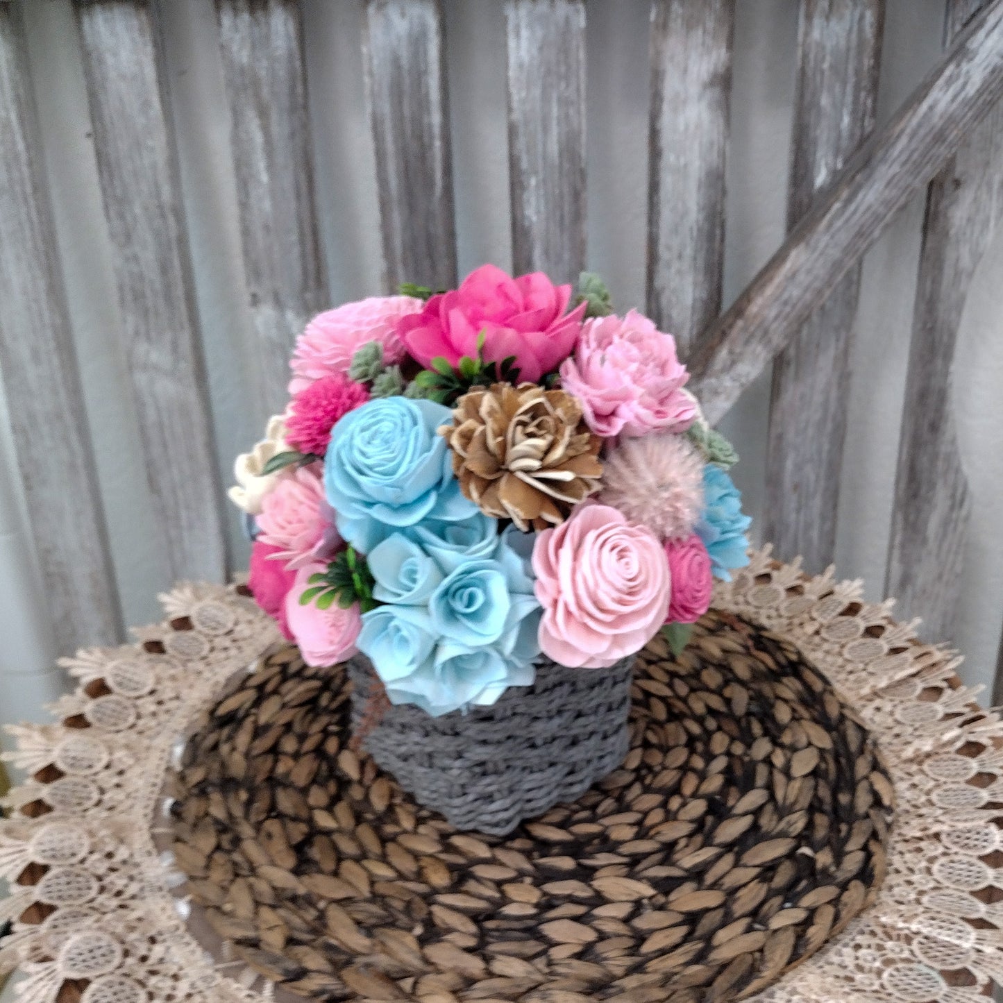 Pink, Blue & Natural Sola Wood Flower Centerpiece in Woven Gray Basket