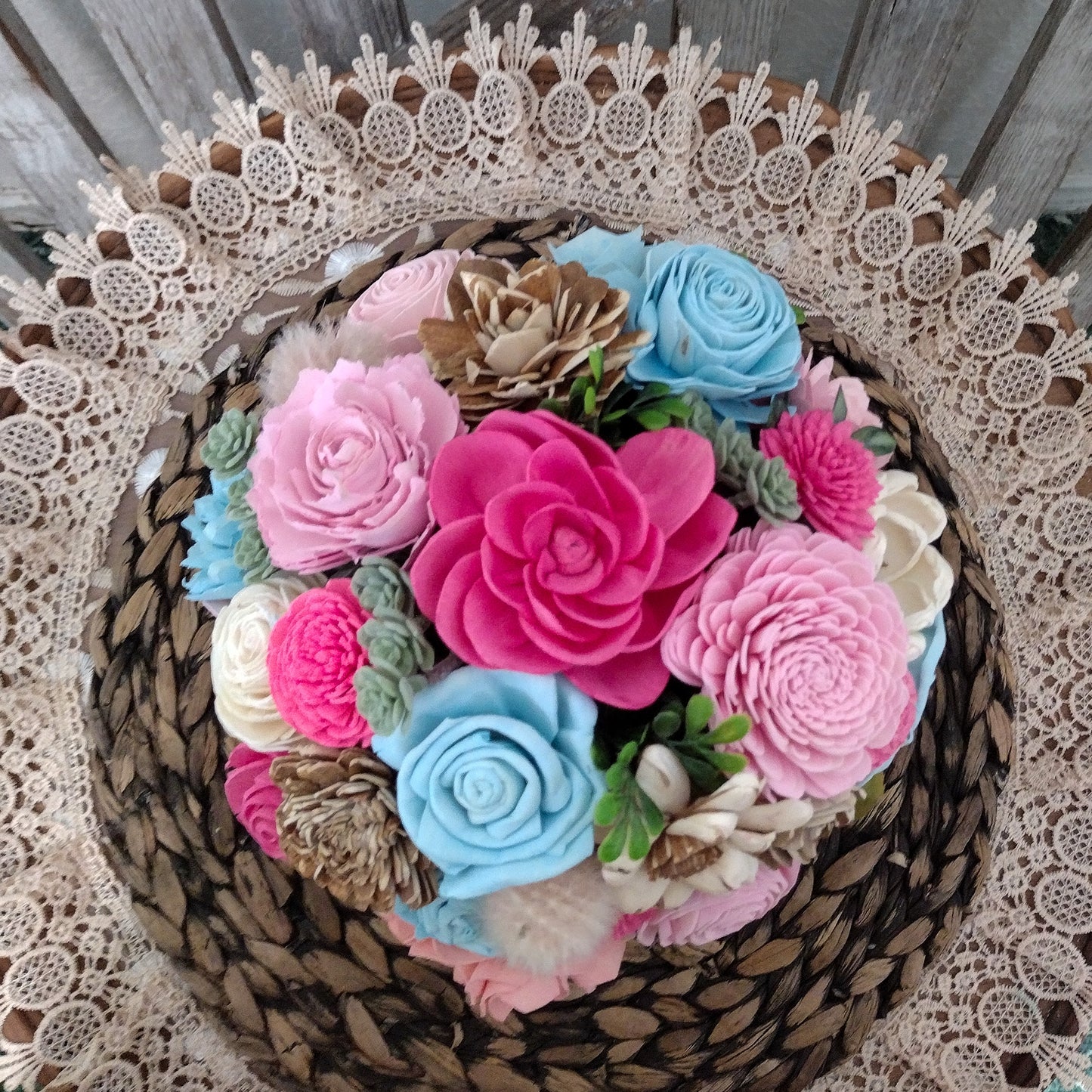 Pink, Blue & Natural Sola Wood Flower Centerpiece in Woven Gray Basket